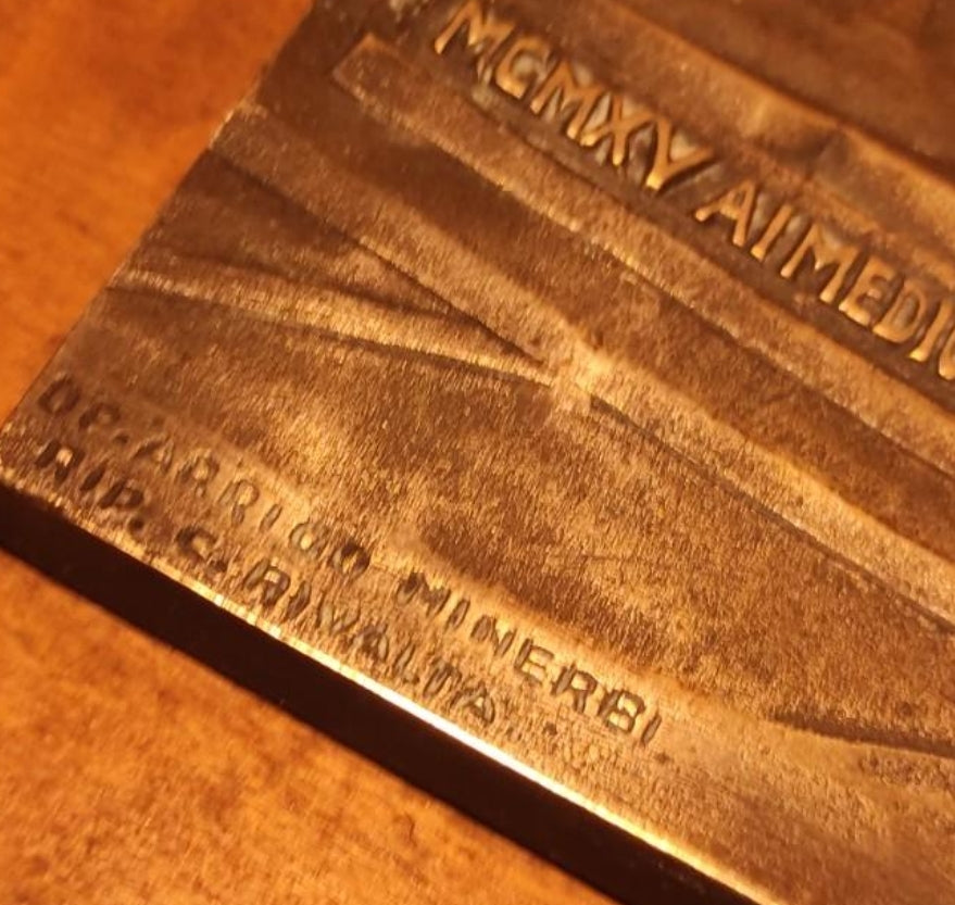 Silver plaque honoring the fallen Italians