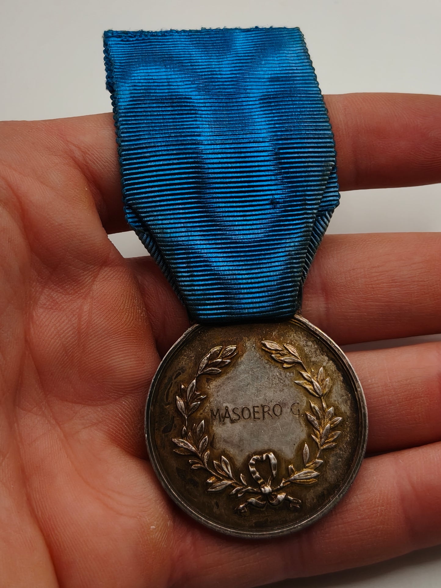 Italienische Tapferkeitsmedaille. Luftfahrt Zweiter Weltkrieg. Name Rückseite