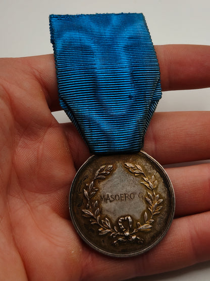 Italienische Tapferkeitsmedaille. Luftfahrt Zweiter Weltkrieg. Name Rückseite