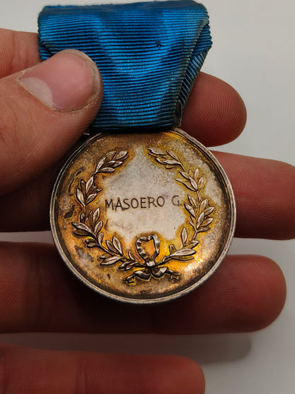 Italienische Tapferkeitsmedaille. Luftfahrt Zweiter Weltkrieg. Name Rückseite